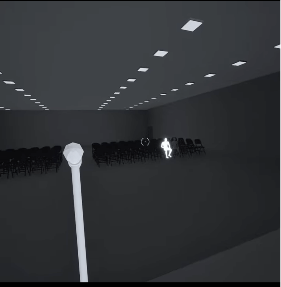 Dominika Švecová - Stage Fright (VR Walkthrough): View from the stage in a black and grey room with white human figure outlined sitting in the audience.